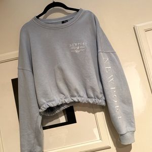 Light blue cinched cropped crew neck